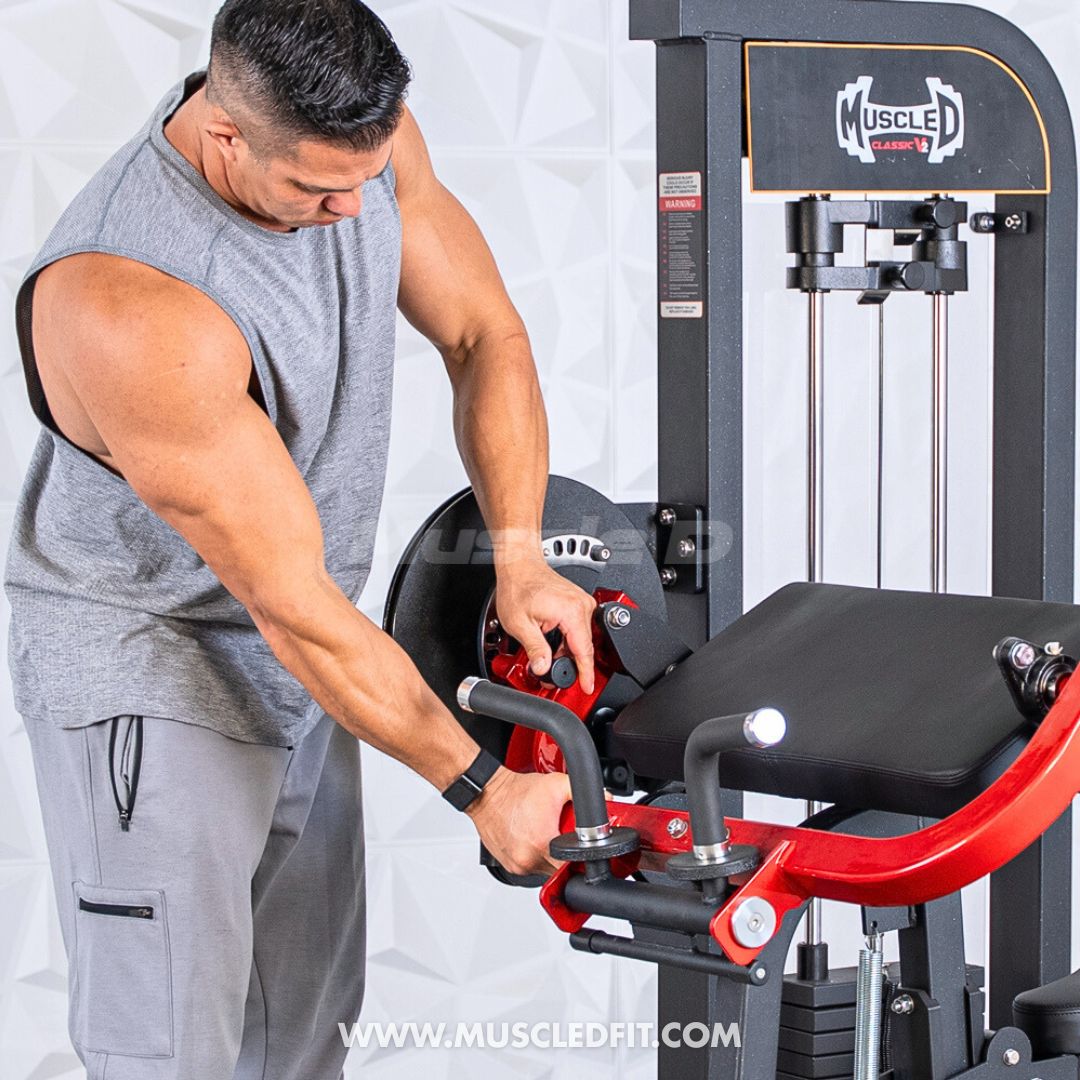 Man using a Classic V2 Biceps/Triceps machine with 'MuscleD Fit' branding on a white background