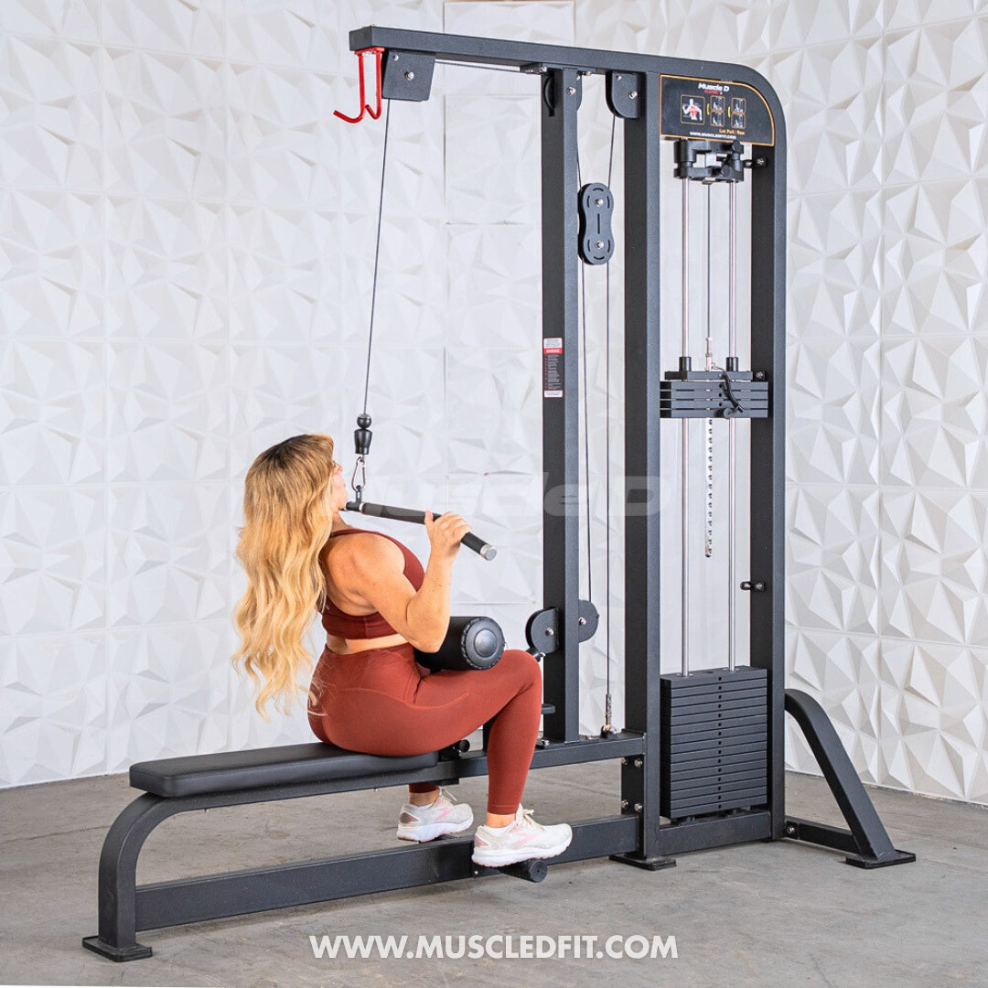Woman exercising on a Classic V2 Lat Pulldown Low Row Combo machine in a home gym setting