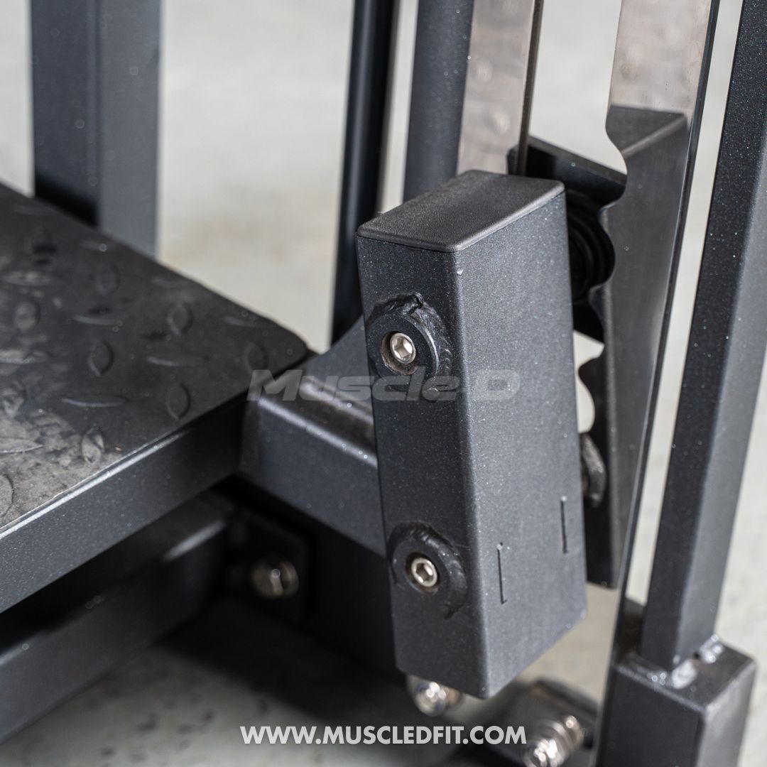 Close-up of a black metal component with 'Muscled Fit' branding on a Classic V2 Multi Hip machine.