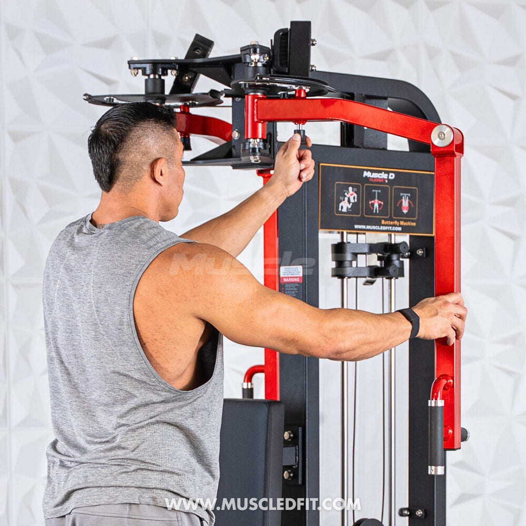 Man using a red and black Classic V2 Pec/Rear Delt Combo machine with a white background