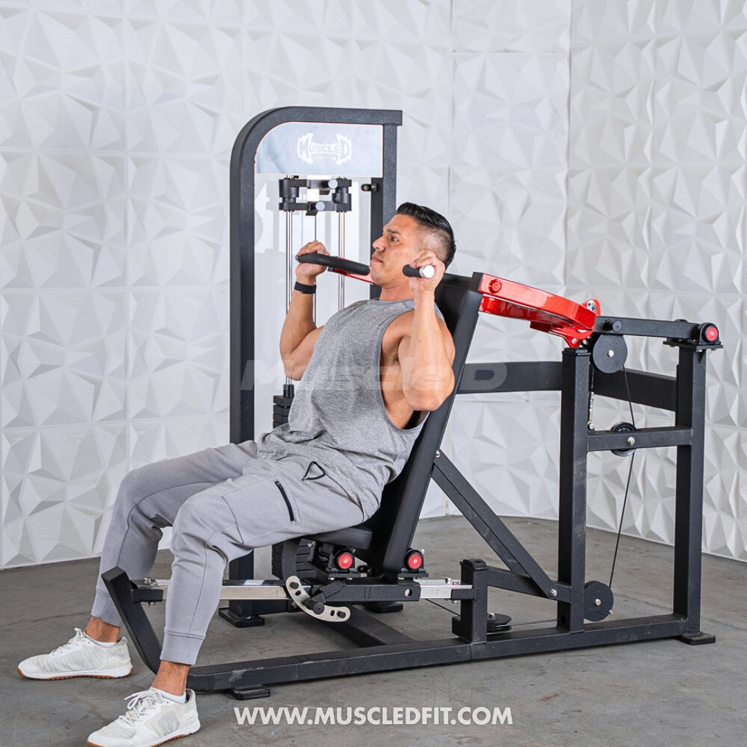 Man using a Classic V2 Selectorized Multi-Press Chest & Shoulder Press machine in a fitness setting with a textured wall background
