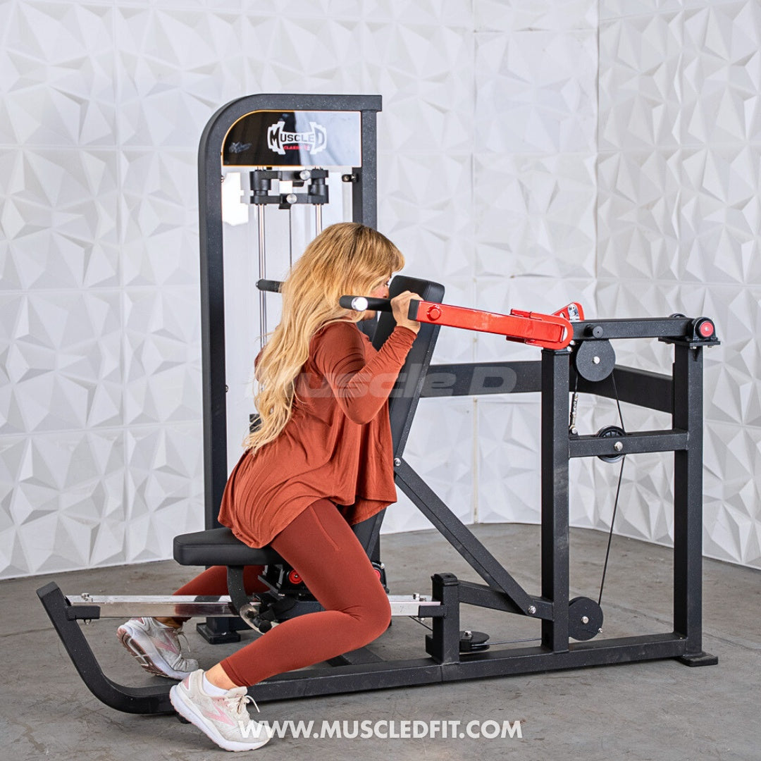 Woman exercising on a Classic V2 Selectorized Multi-Press Chest & Shoulder Press machine in a gym setting