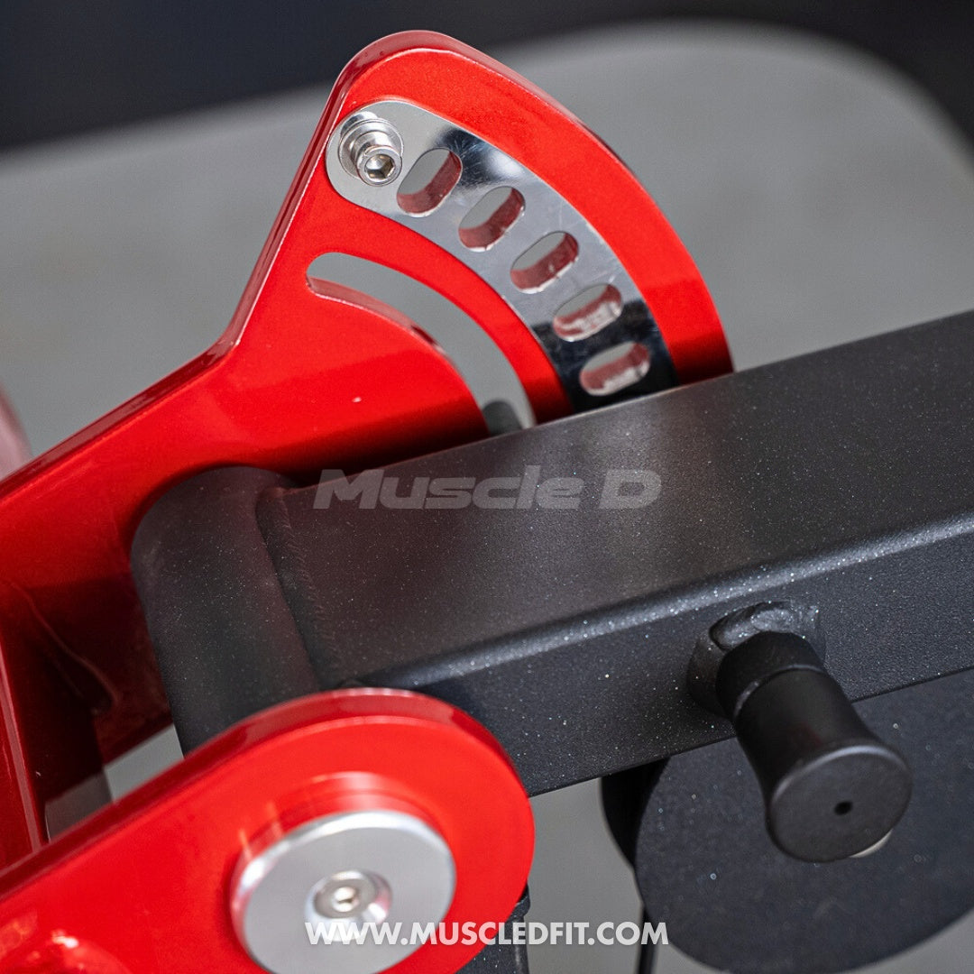 Close-up of a red and black Classic V2 Selectorized Multi-Press Chest & Shoulder Press machine component with 'Muscle D' branding.