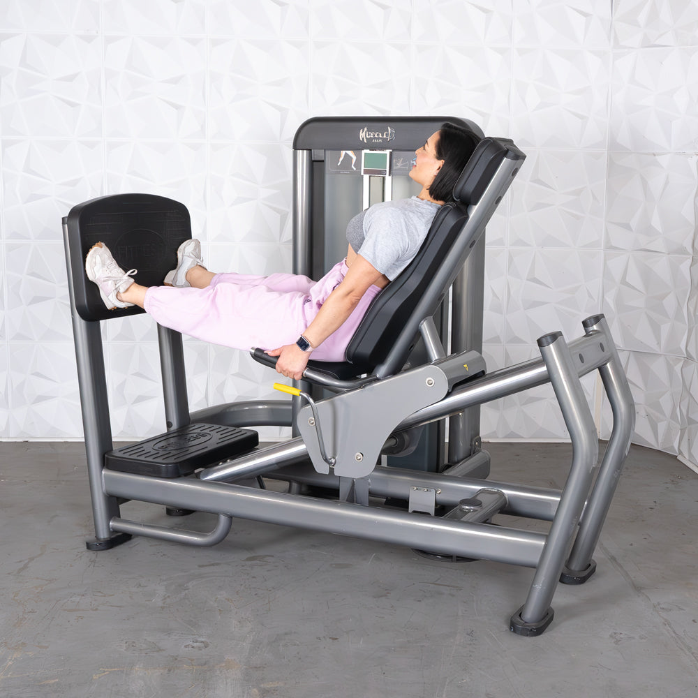 commercial black and dark grey selectorized leg press calf raise combo machine