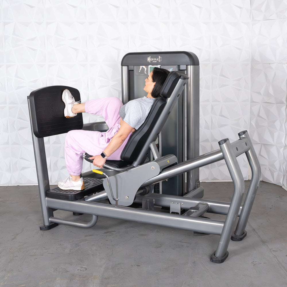 commercial black and dark grey selectorized leg press calf raise combo machine