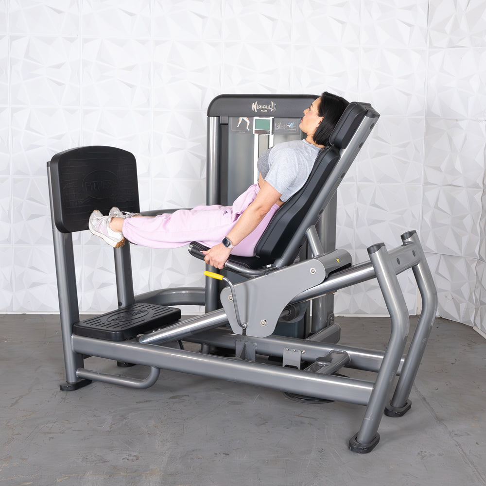 commercial black and dark grey selectorized leg press calf raise combo machine