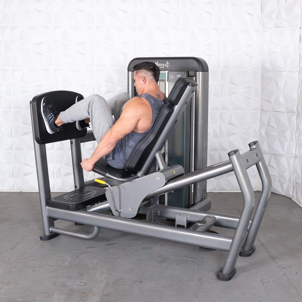 commercial black and dark grey selectorized leg press calf raise combo machine