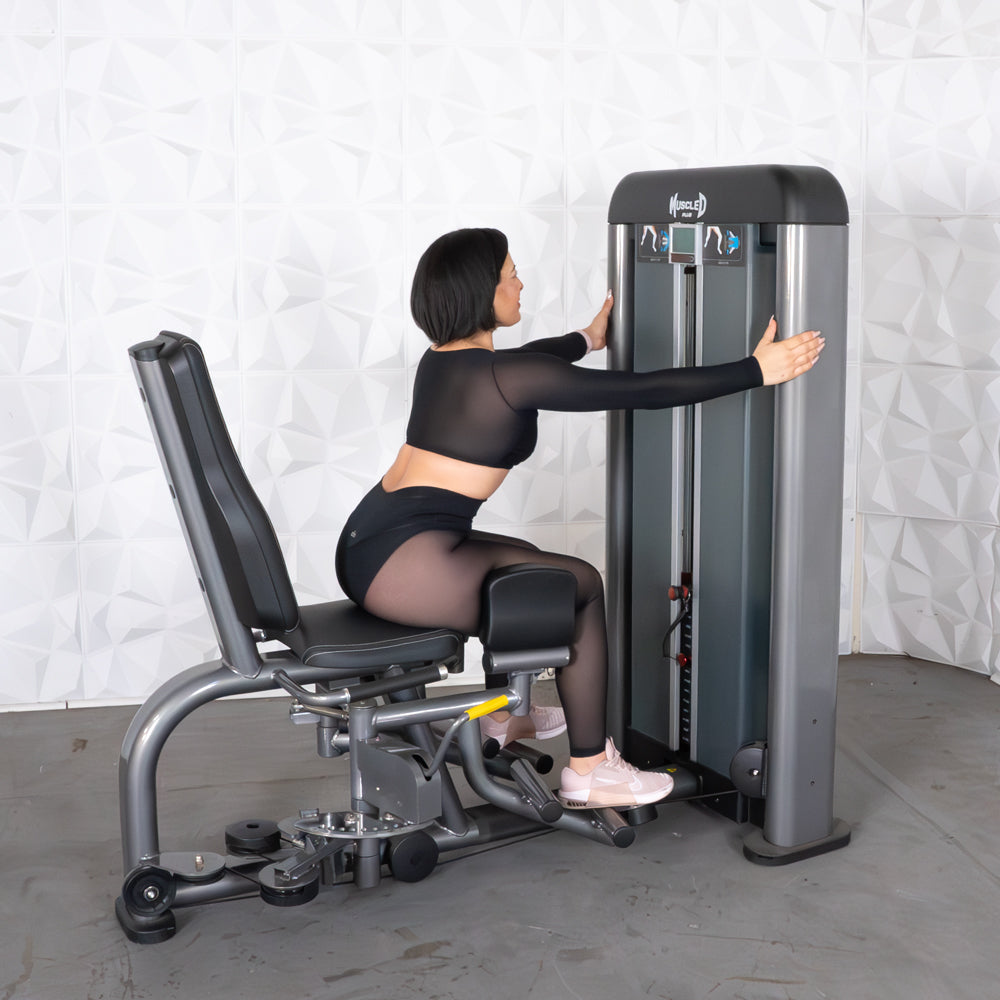 commercial black and dark grey selectorized inner outer thigh combo machine