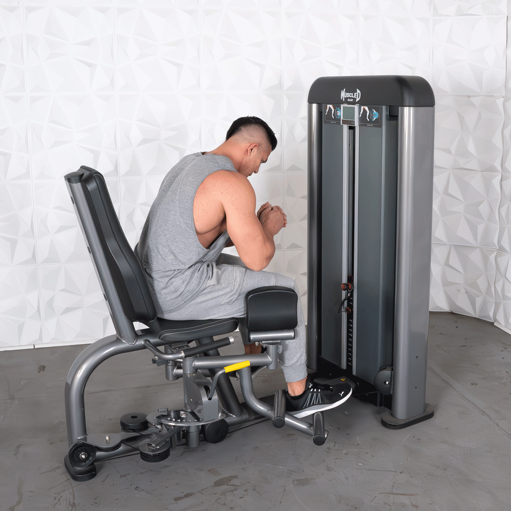 commercial black and dark grey selectorized inner outer thigh combo machine