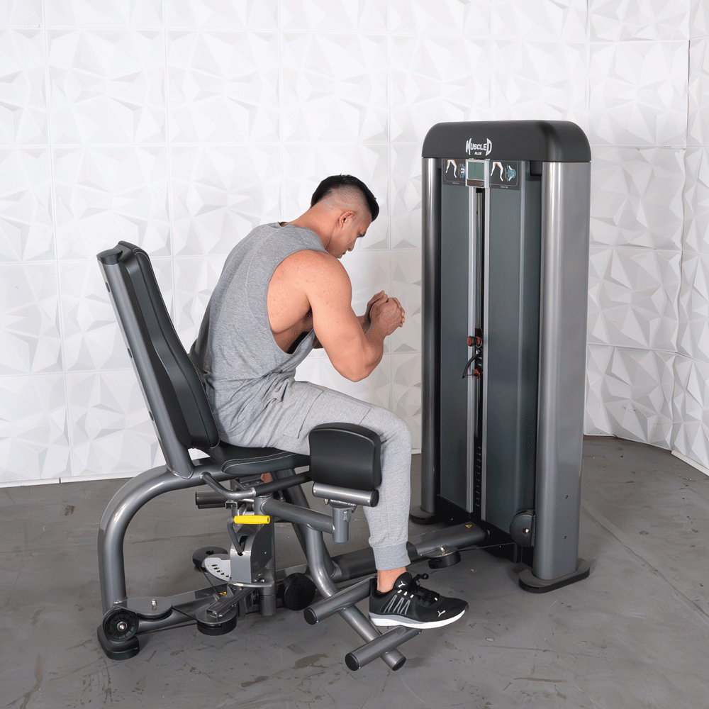 commercial black and dark grey selectorized inner outer thigh combo machine