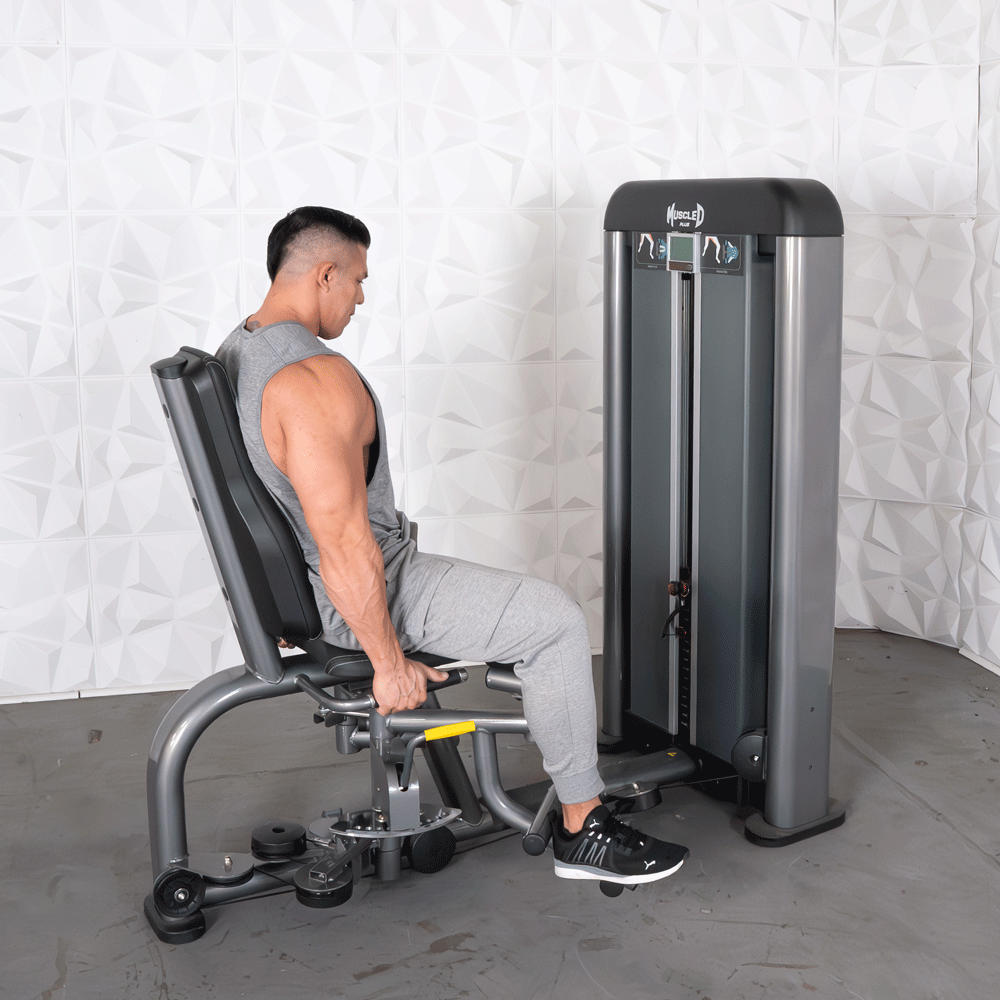 commercial black and dark grey selectorized inner outer thigh combo machine