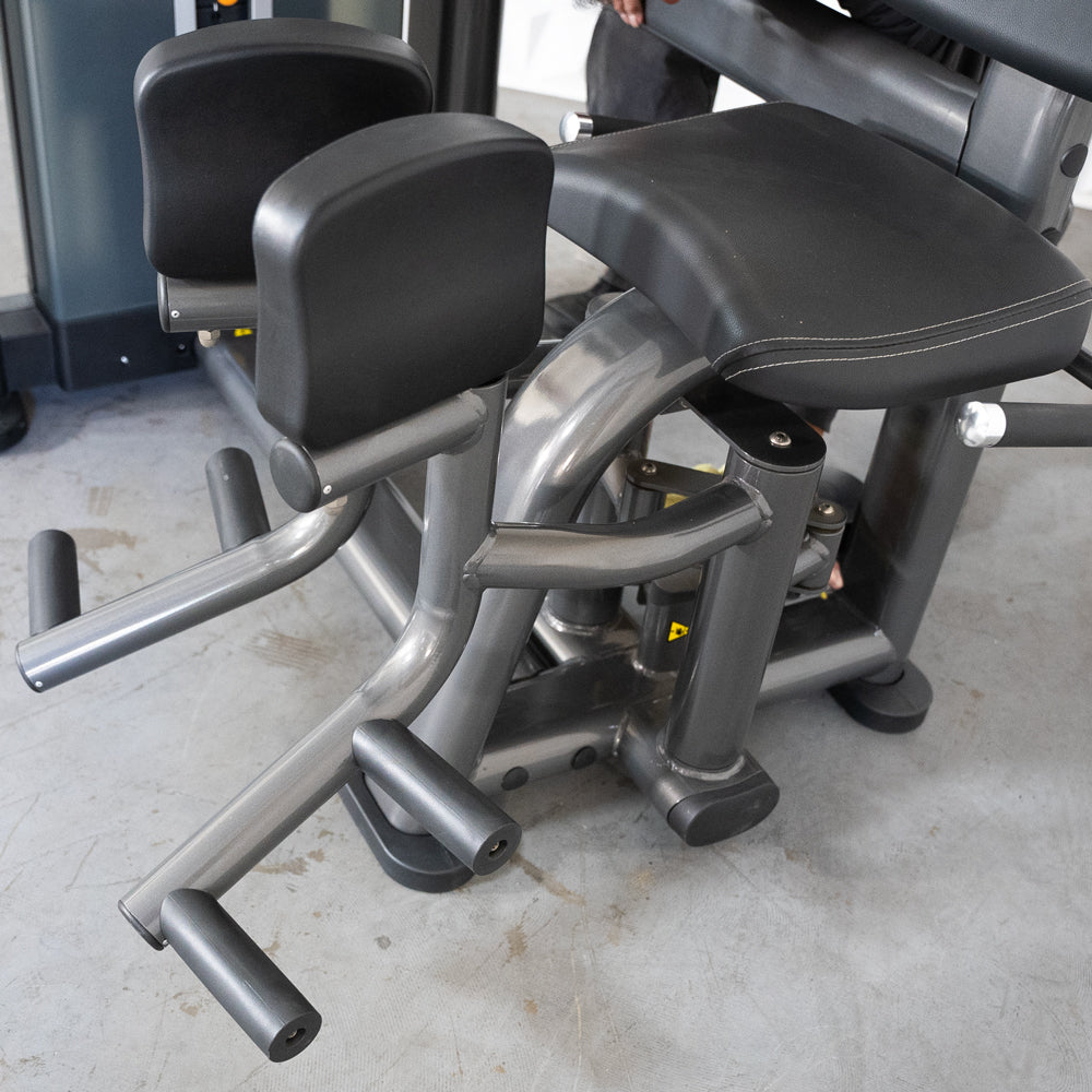 commercial selectorized black and dark grey inner thigh machine detail