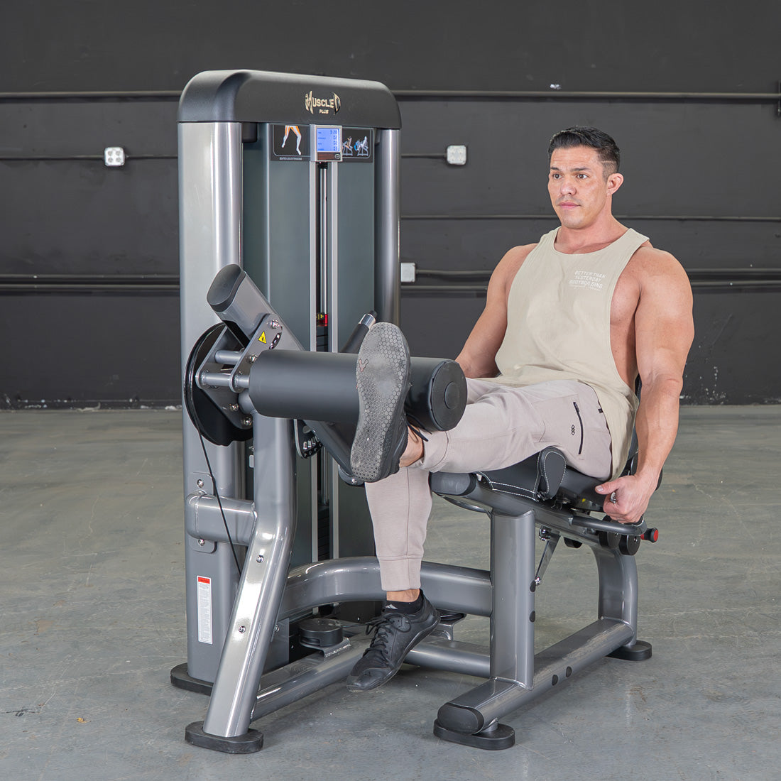 muscle d fitness commercial selectorized black and dark grey elite plus leg extension leg machine