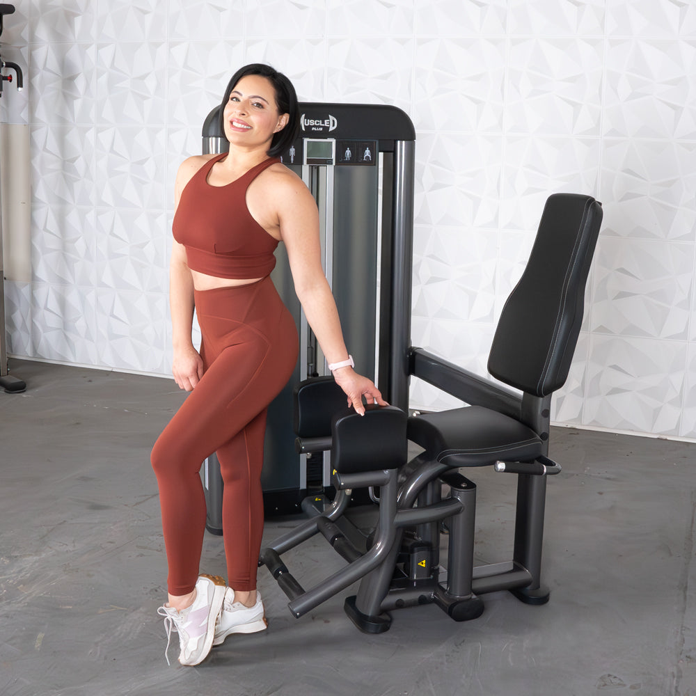 commercial selectorized black and dark grey outer thigh machine