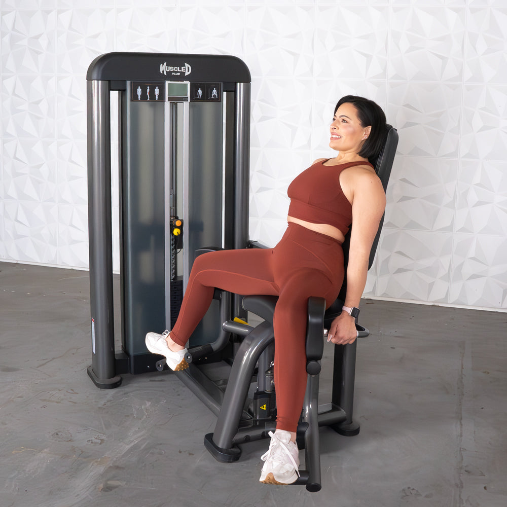 commercial selectorized black and dark grey outer thigh machine