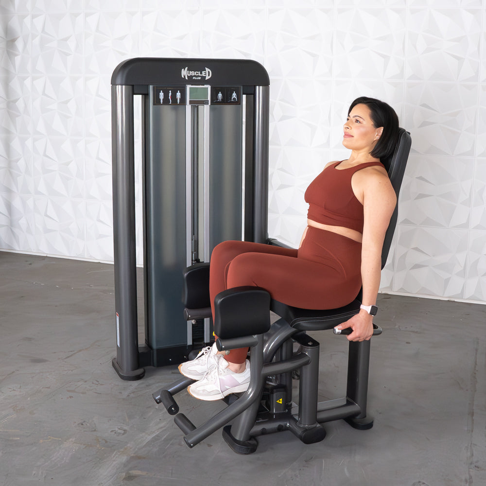 commercial selectorized black and dark grey outer thigh machine