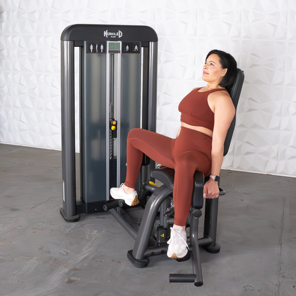 commercial selectorized black and dark grey outer thigh machine