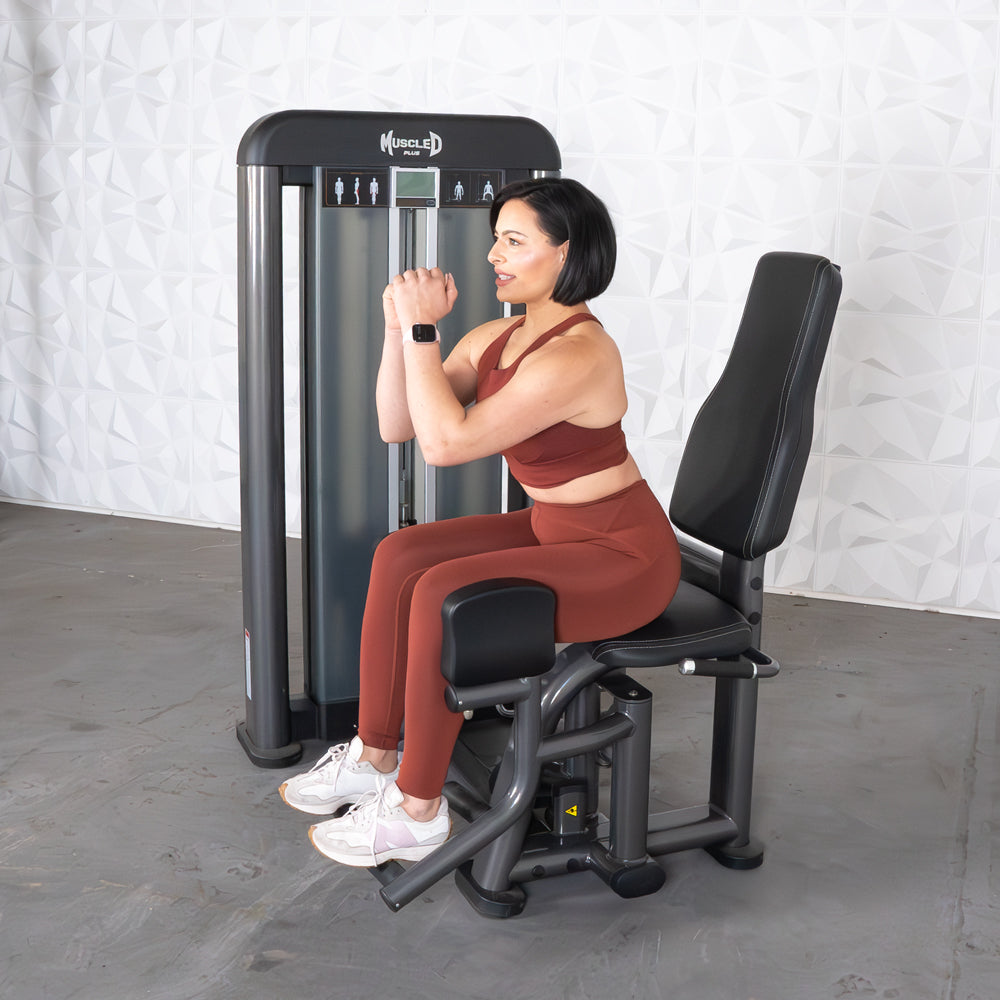 commercial selectorized black and dark grey outer thigh machine