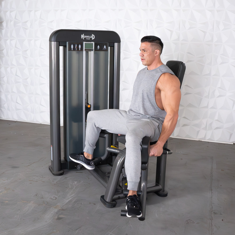 commercial selectorized black and dark grey outer thigh machine