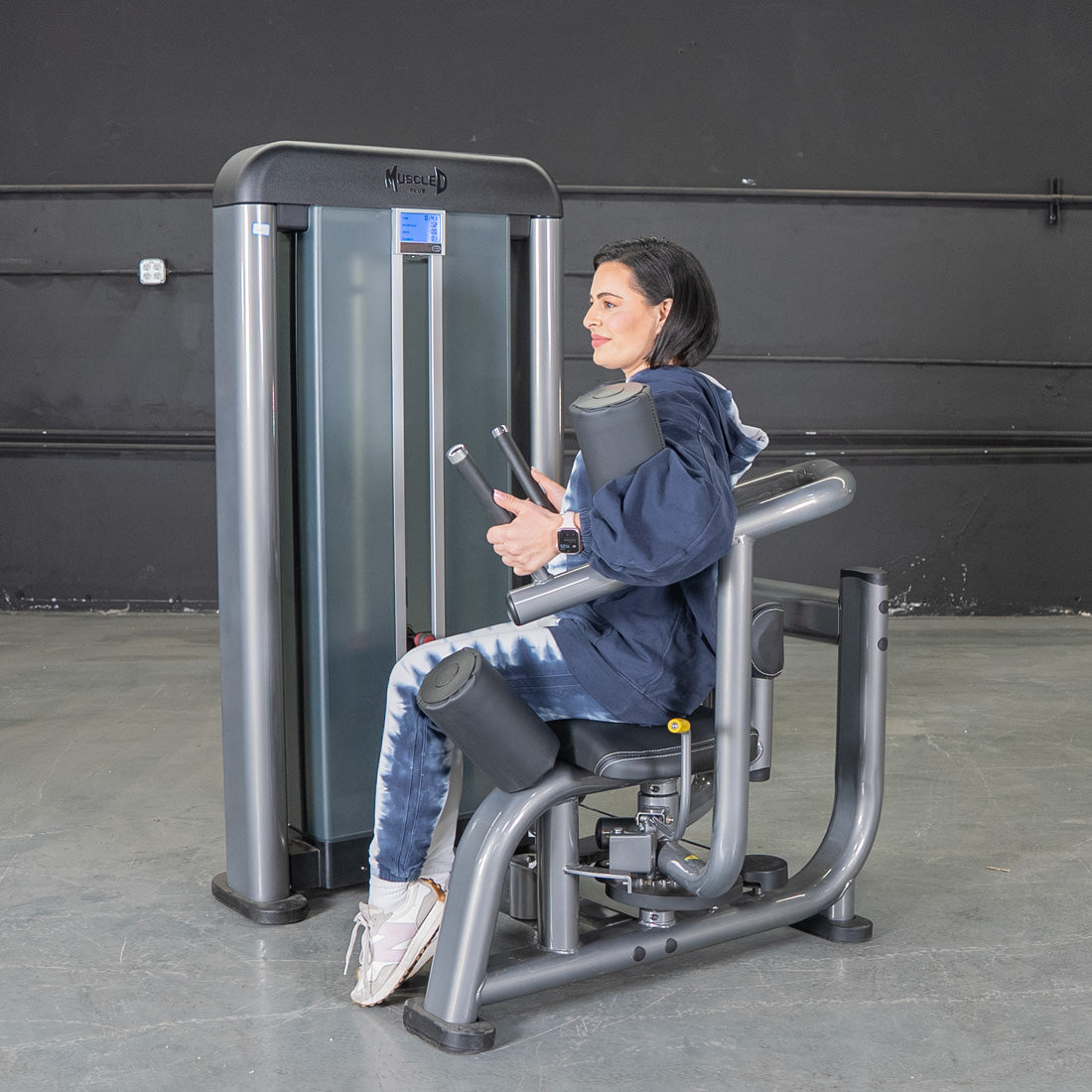 muscle d fitness commercial selectorized black and dark grey elite plus rotary torso machine
