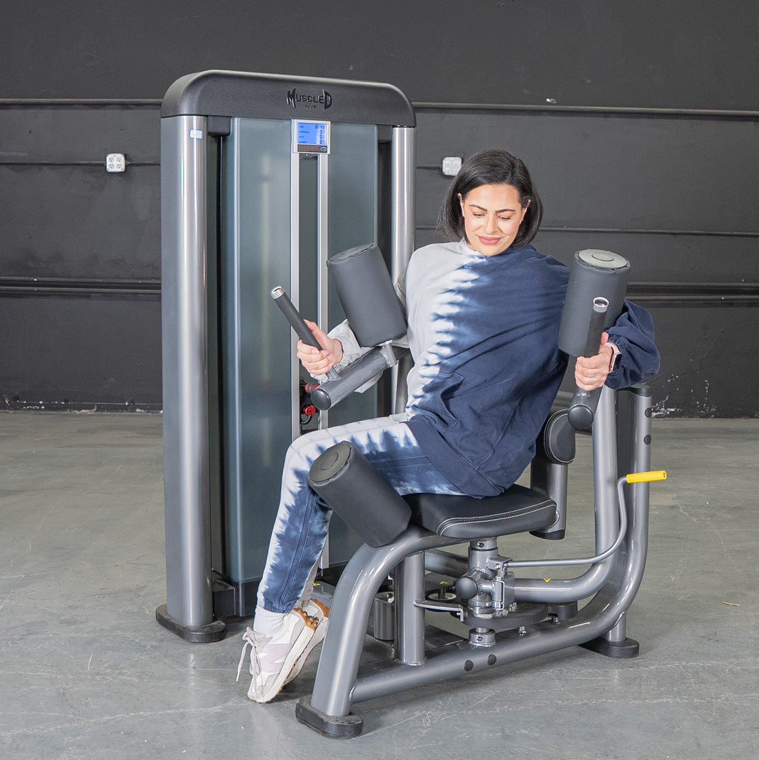 muscle d fitness commercial selectorized black and dark grey elite plus rotary torso machine
