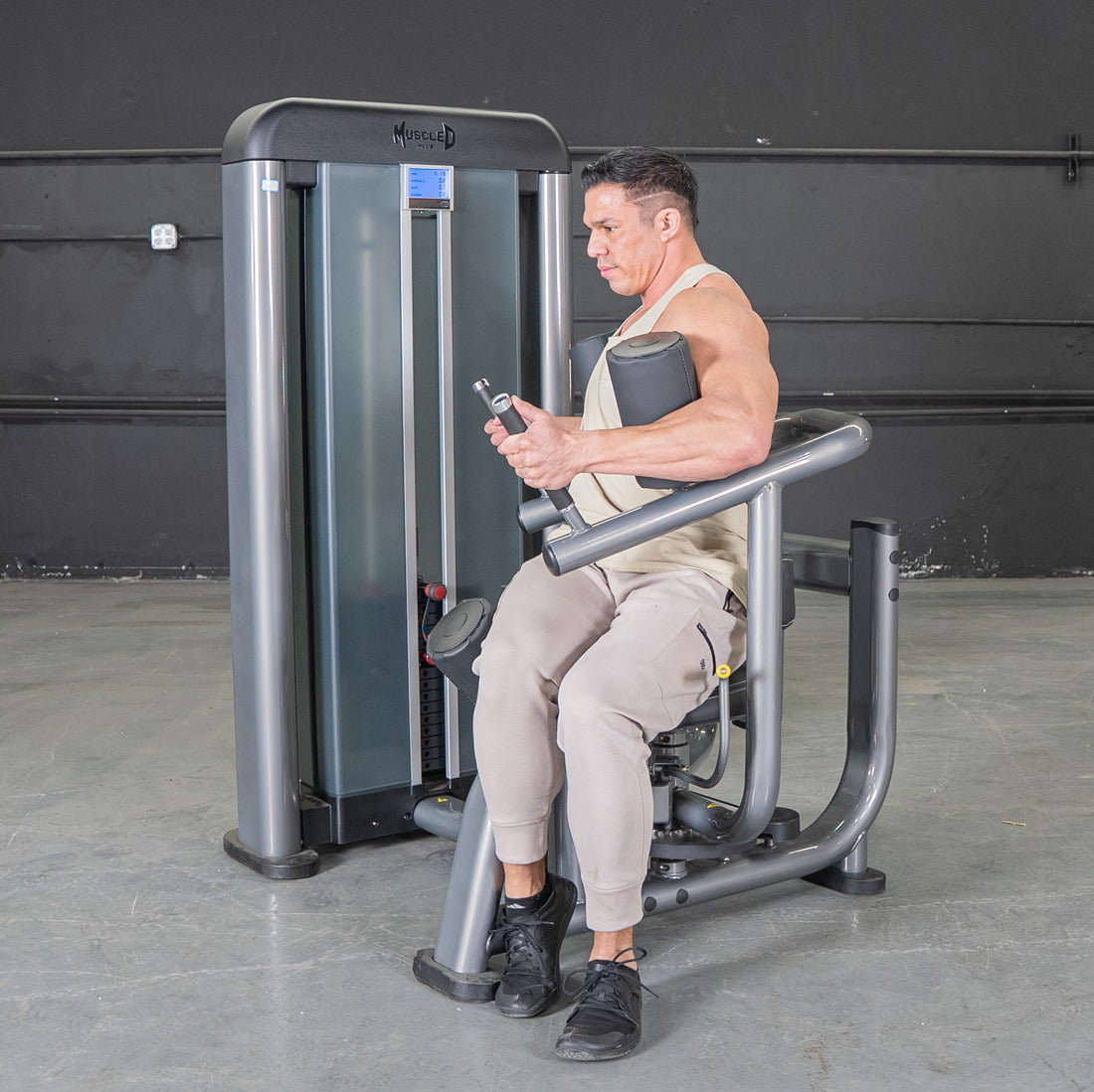 muscle d fitness commercial selectorized black and dark grey elite plus rotary torso machine