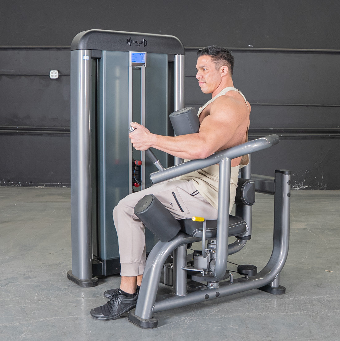 muscle d fitness commercial selectorized black and dark grey elite plus rotary torso machine