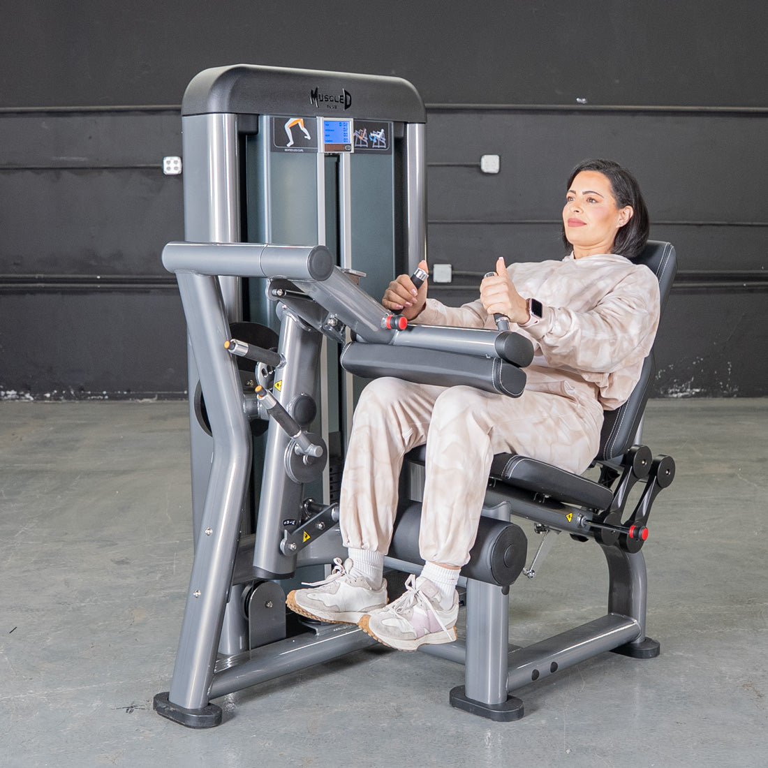 muscle d fitness commercial selectorized black and dark grey elite plus seated leg curl machine