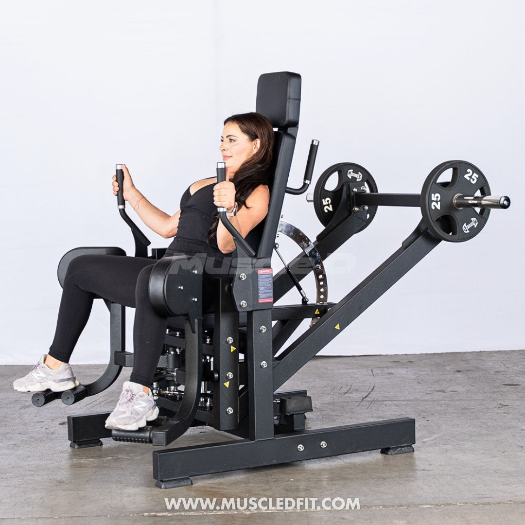 Woman using an Excel 3D Glute / Outer Thigh machine with weights in a gym setting.