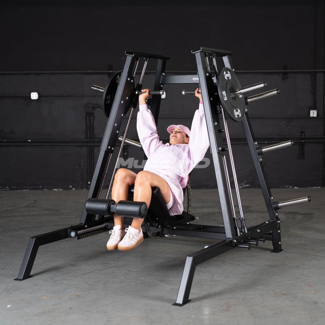 Person using an Excel Flat / Incline / Decline Convergent Bench machine in a gym setting by Muscle D Fitness