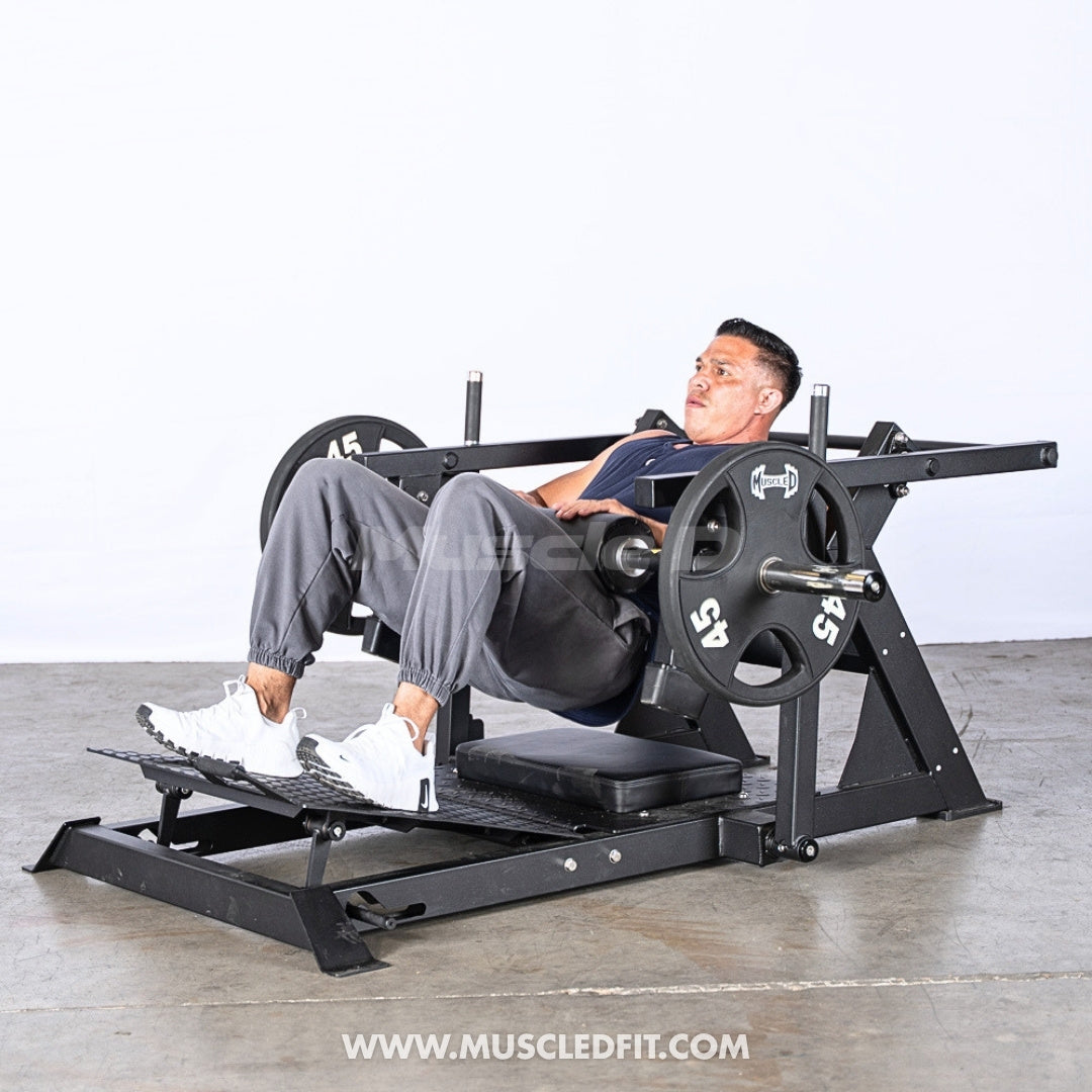 Person using an Excel Leverage Hip Thruster machine in a gym setting by Muscle D Fitness.