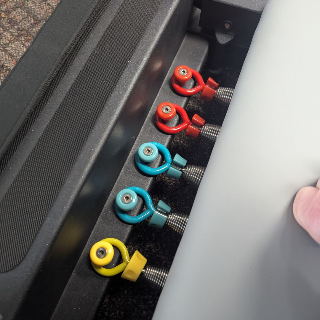 sleek light grey pilates reformer table with padded platform, adjustable foot bar, and sturdy metal frame for home or studio use