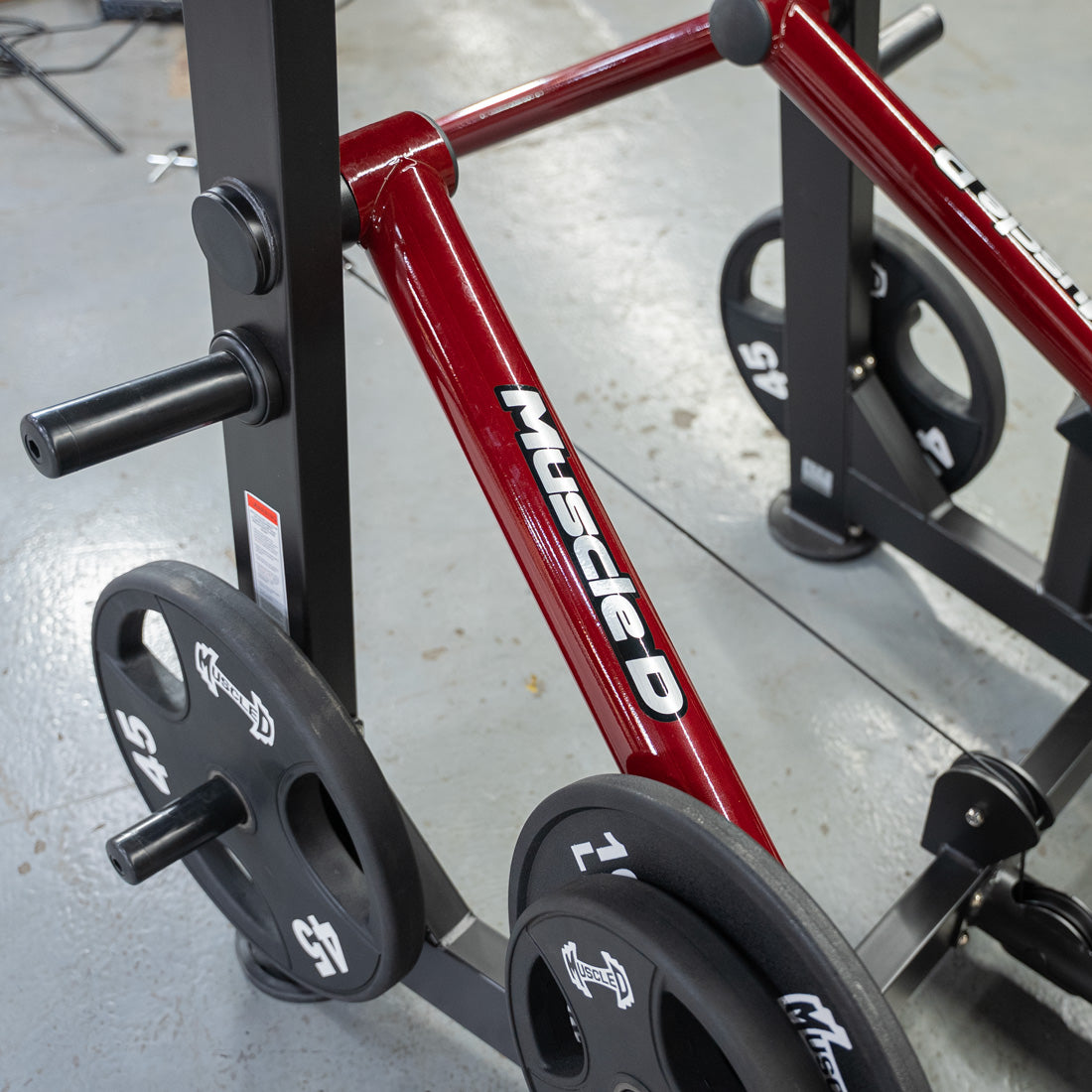 muscle d fitness commercial plate loaded black and maroon handle power leverage v2 abductor/adductor machine detail