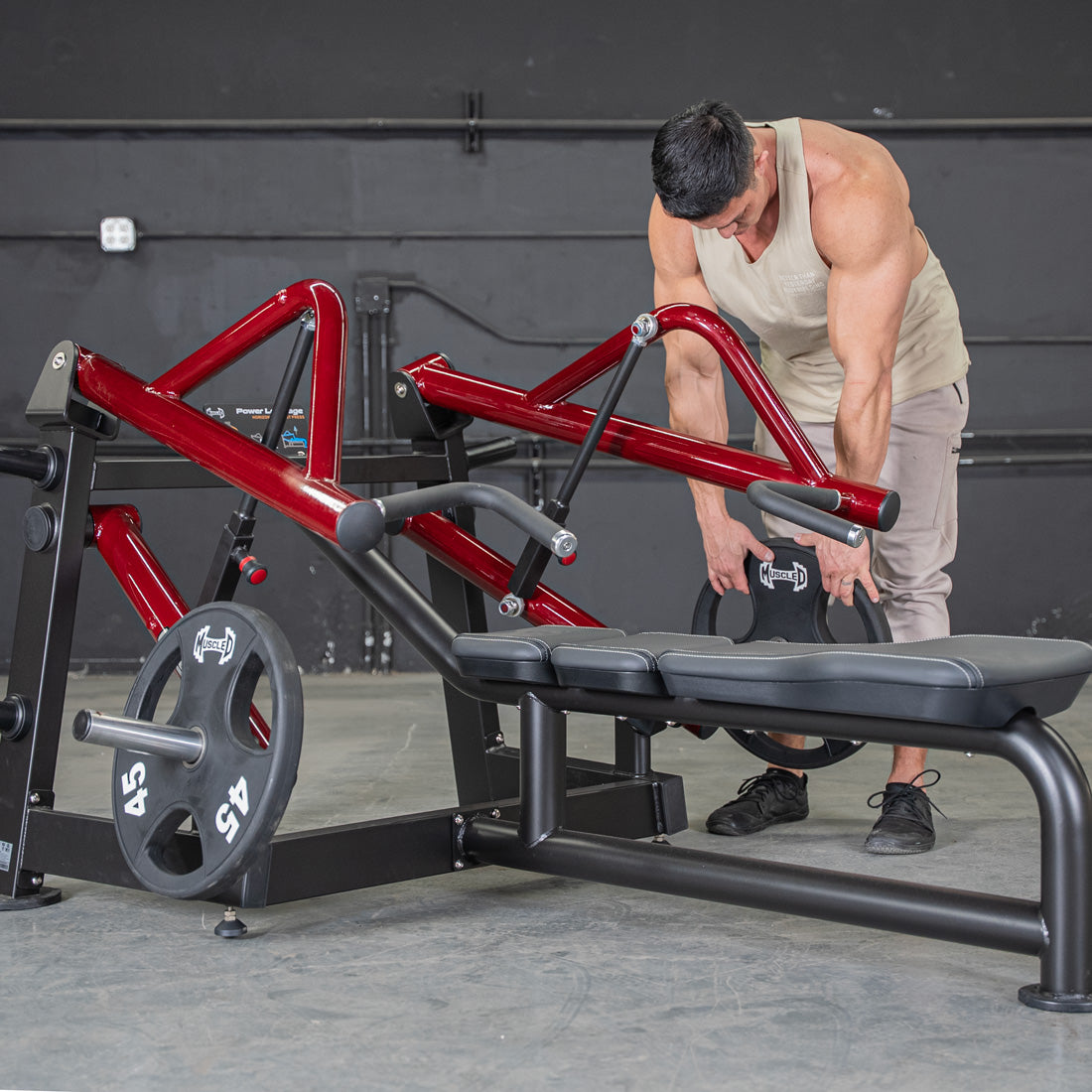 muscle d fitness commercial plate loaded black and maroon power leverage v2 iso lateral horizontal chest press machine close up