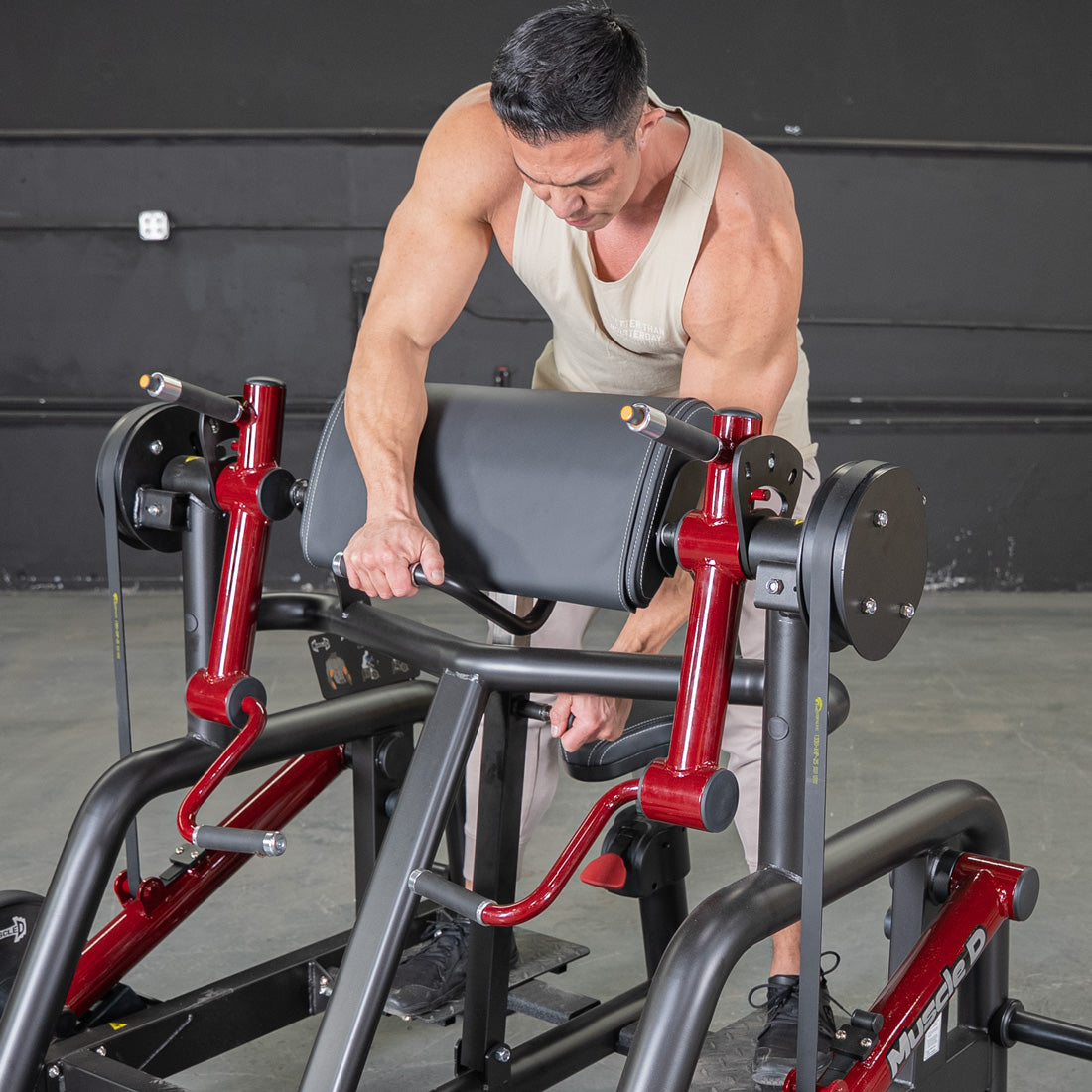 muscle d fitness commercial plate loaded black and maroon power leverage v2 iso lateral biceps curl machine close up