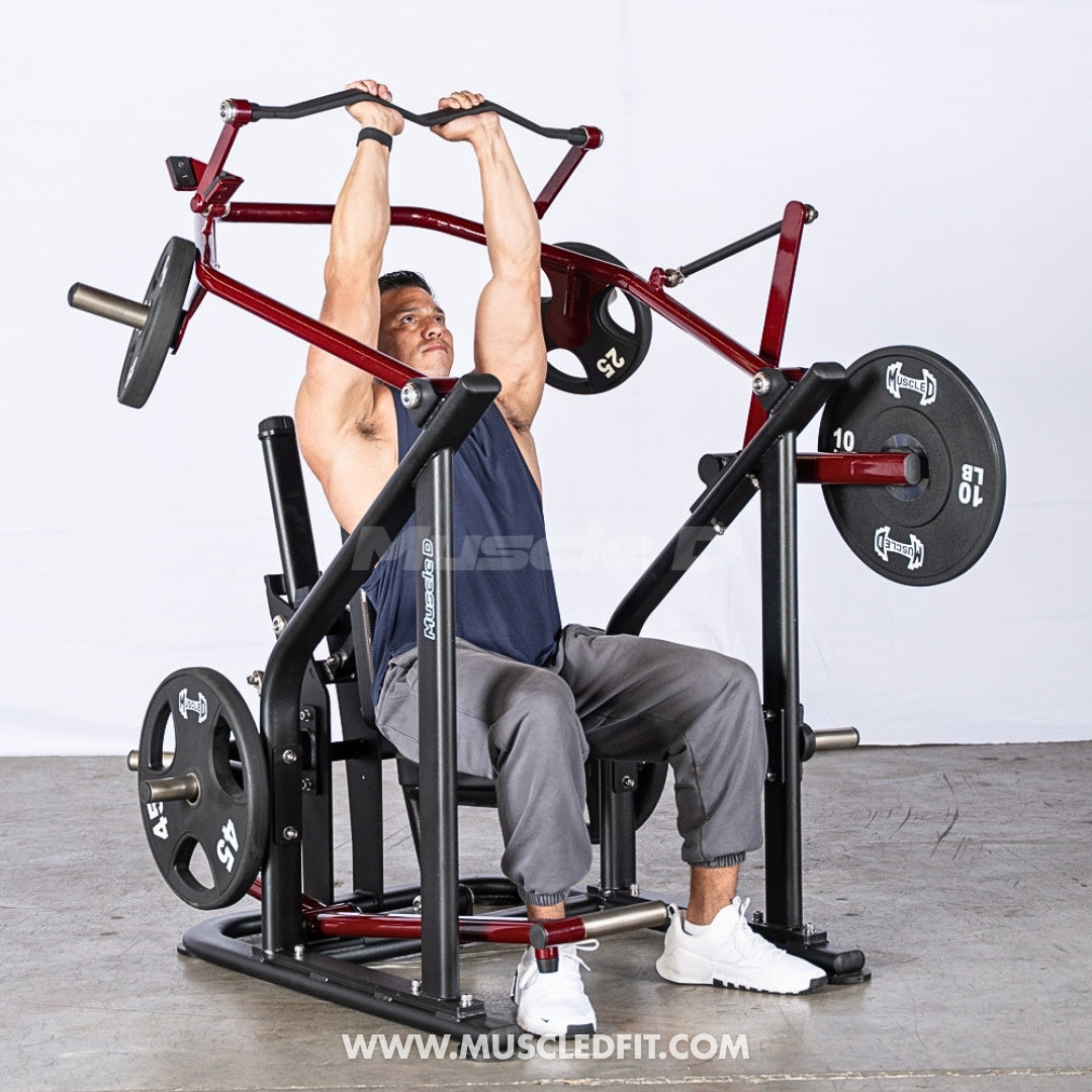 Man exercising on a Pro Strength Overhead Triceps machine my Muscle D Fitness in a gym setting
