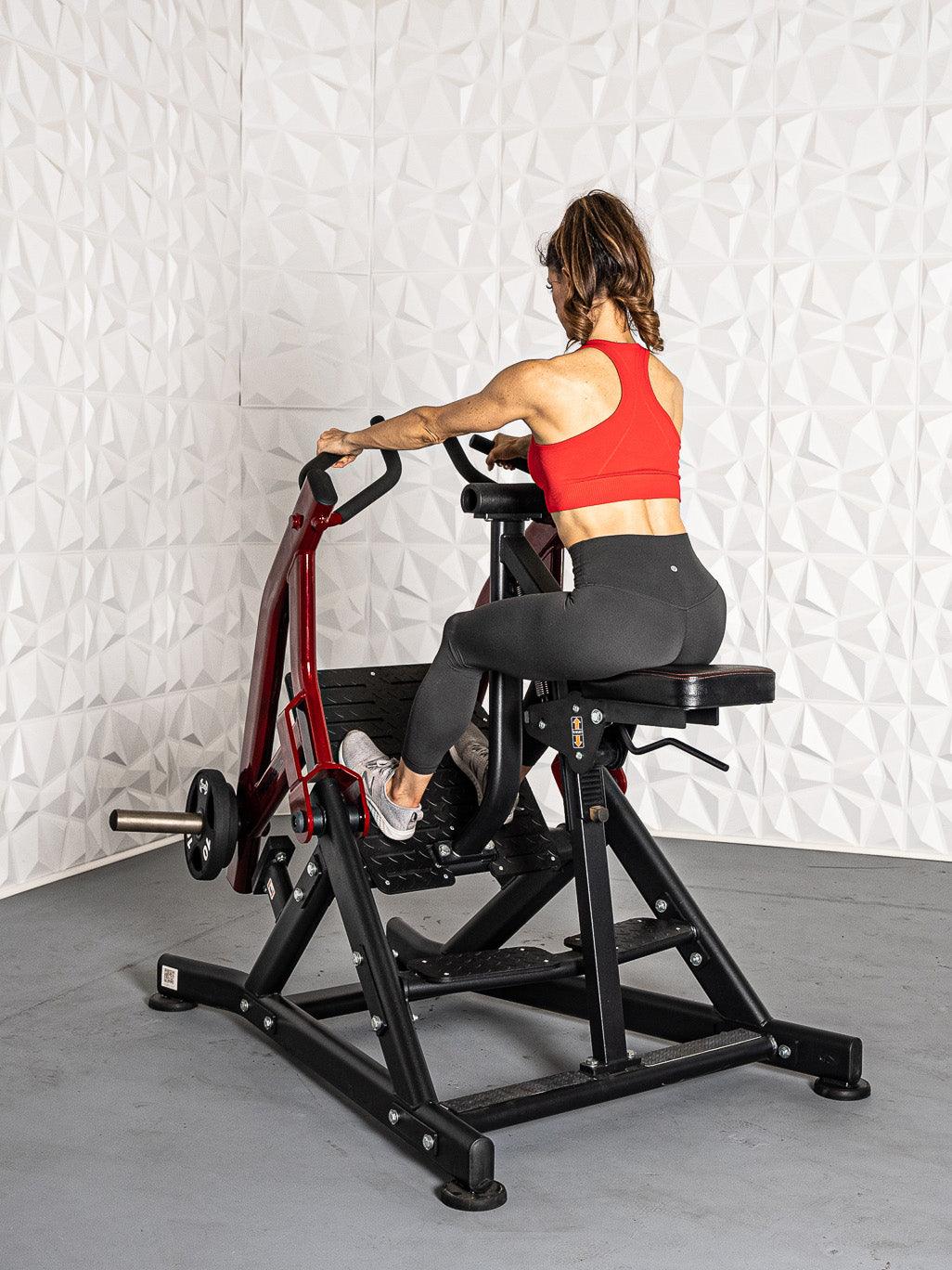 Woman trainer on a Pro Strength Seated Row by Muscle D Fitness