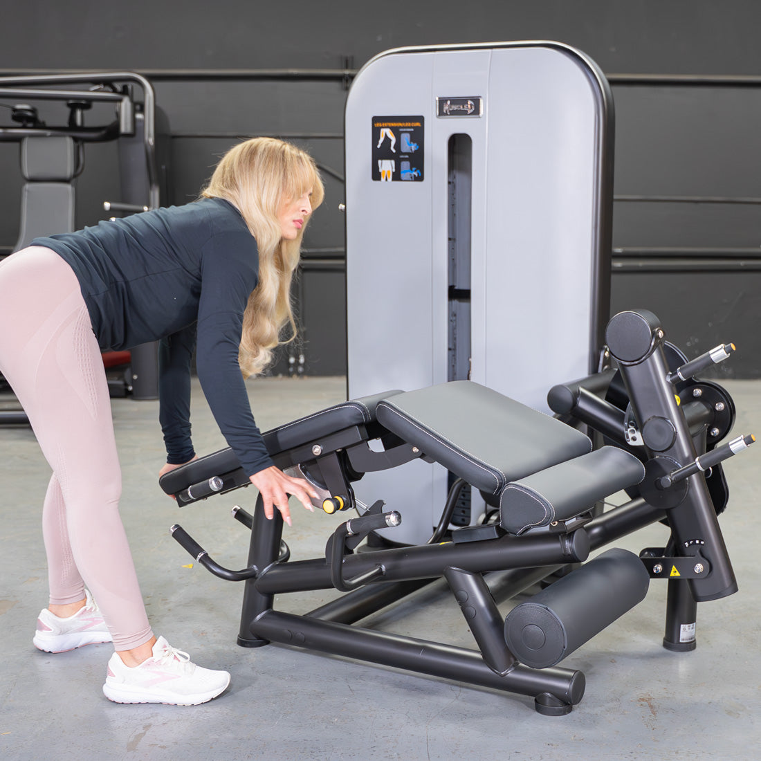 muscle d fitness commercial selectorized vogue black and light grey leg extension prone leg curl combo machine