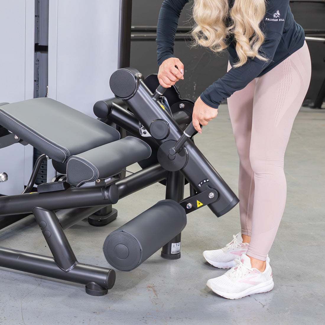 muscle d fitness commercial selectorized vogue black and light grey leg extension prone leg curl combo machine close up