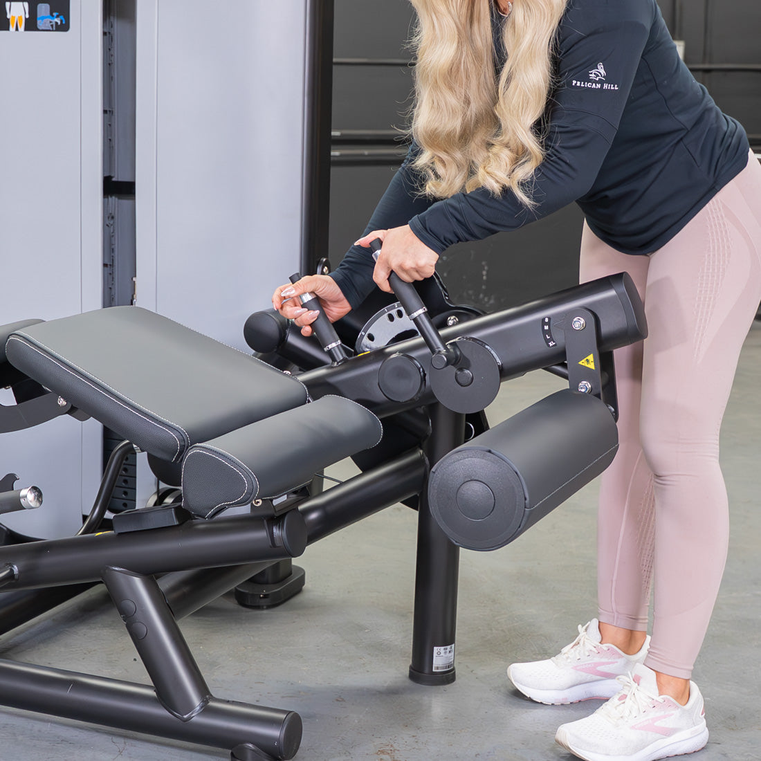 muscle d fitness commercial selectorized vogue black and light grey leg extension prone leg curl combo machine close up