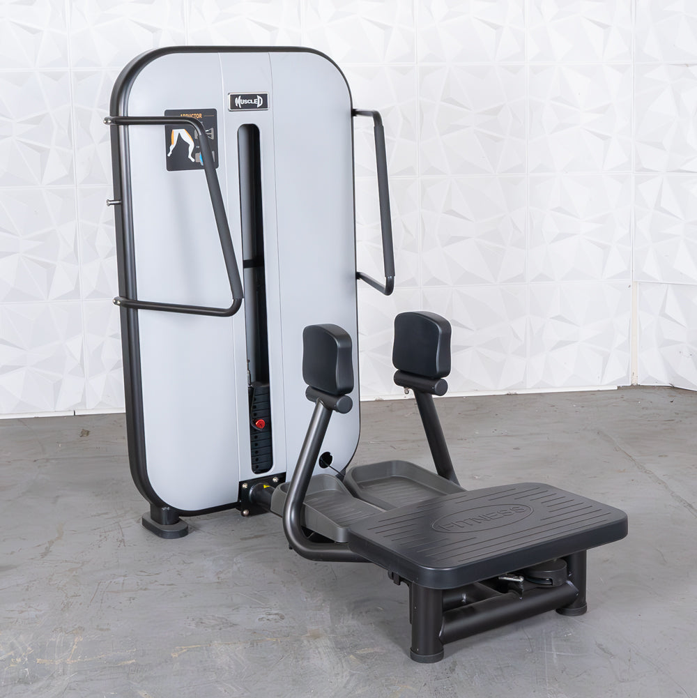 commercial grade black and white selectorized standing abductor machine