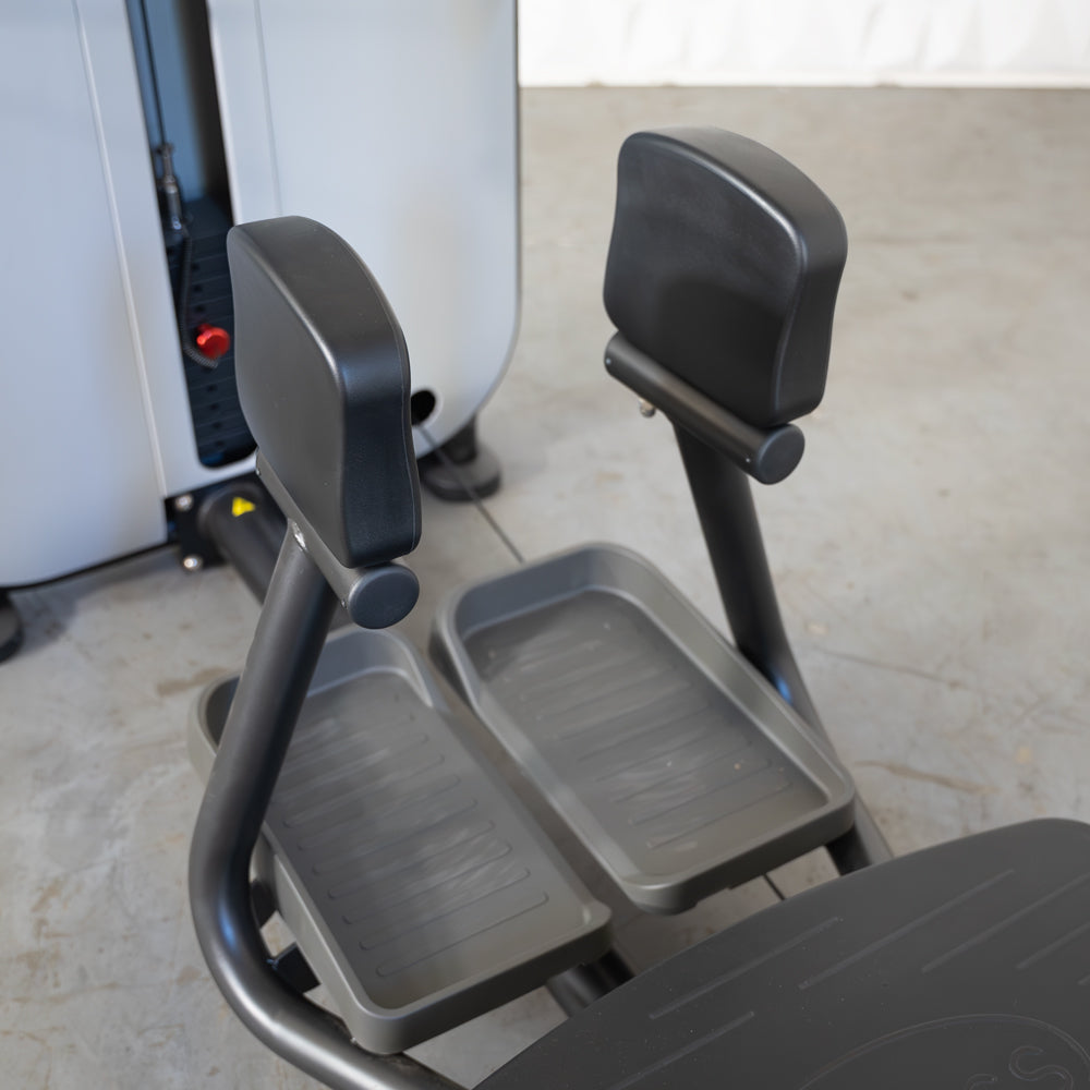 commercial grade black and white selectorized standing abductor machine detail