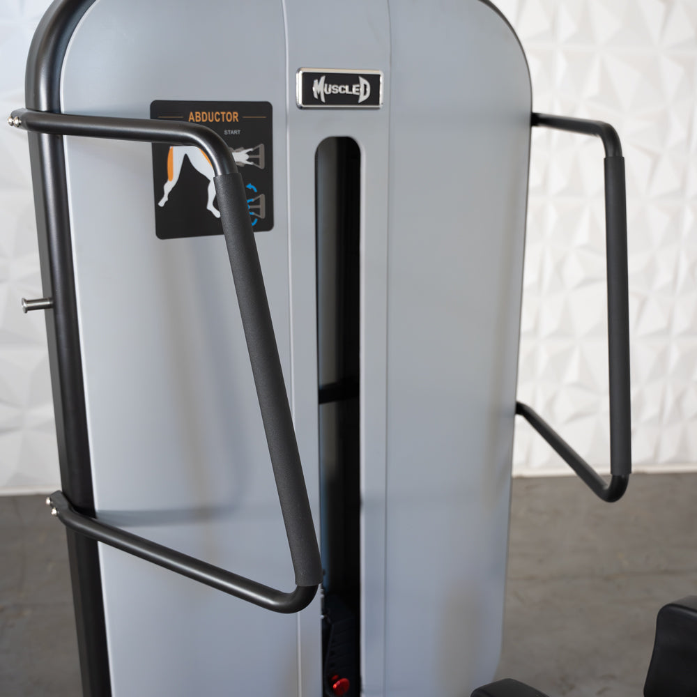 commercial grade black and white selectorized standing abductor machine detail