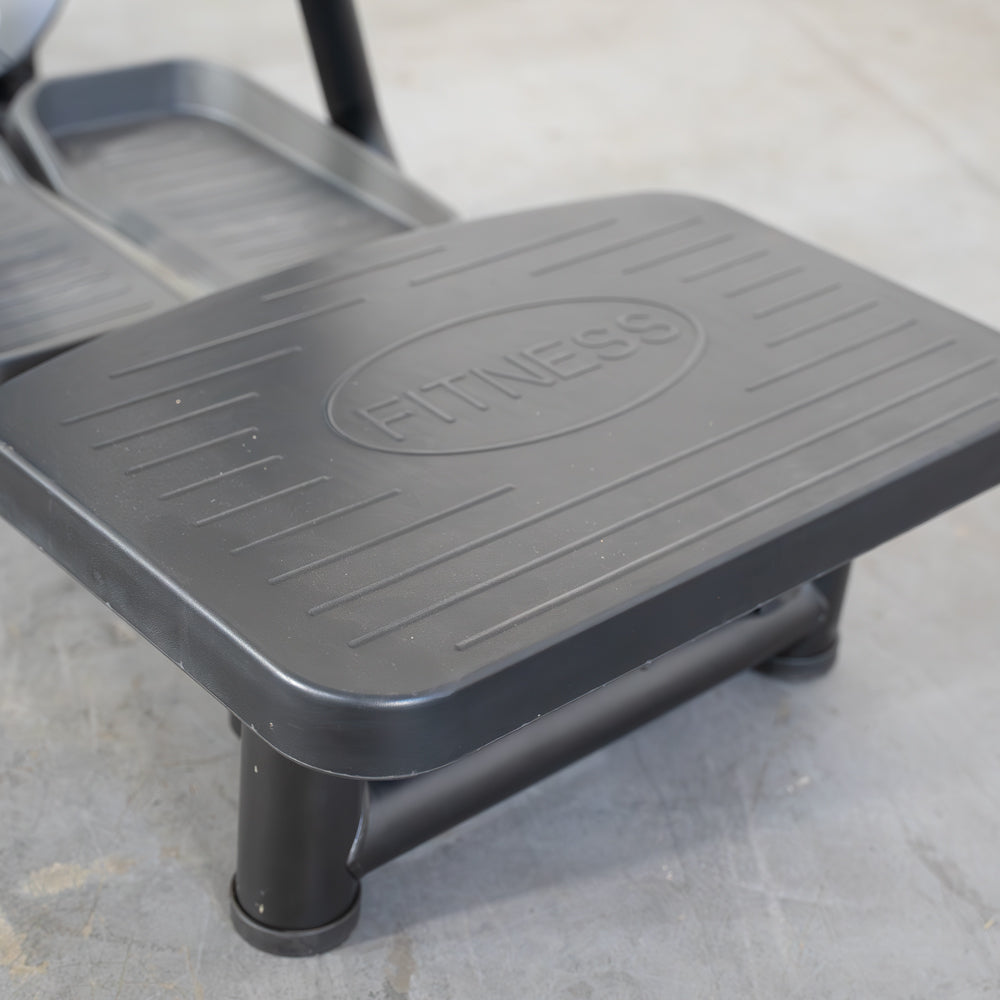 commercial grade black and white selectorized standing abductor machine detail