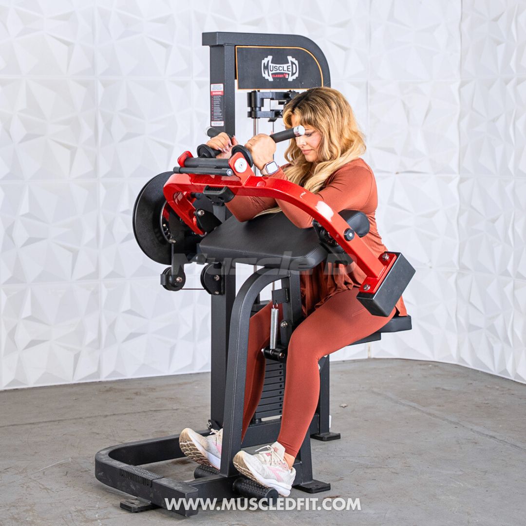 Woman using a Classic V2 Biceps/Triceps machine in a gym setting with a white textured wall background.