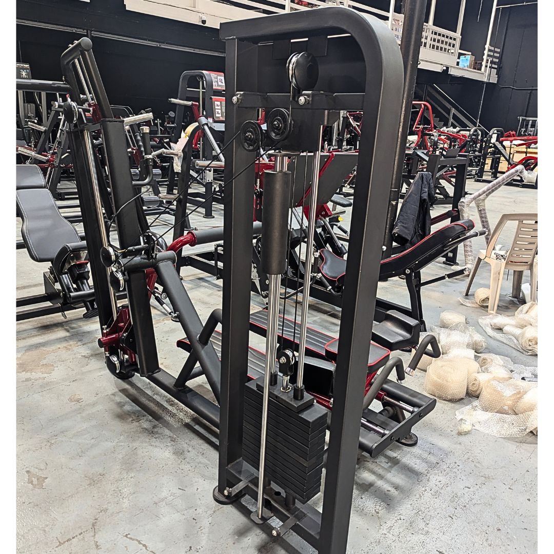 Gym equipment including a cable machine in a gym setting.