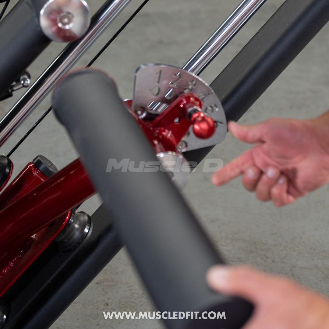 Close-up of a person using a Classic V2 Glute Kick machine with 'Muscle D' branding.