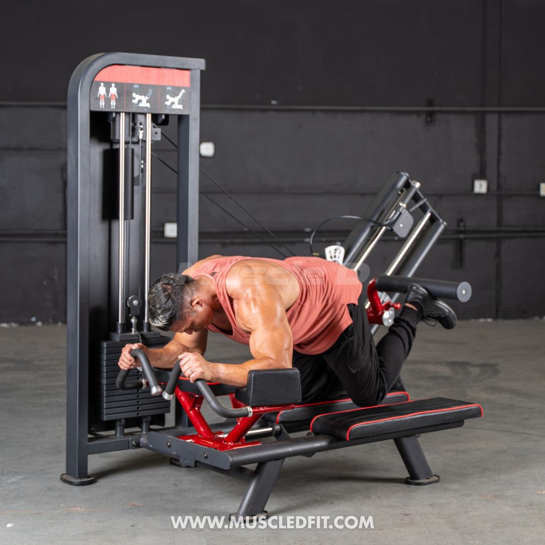 Man exercising on a Classic V2 Glute Kickmachine with a dark background