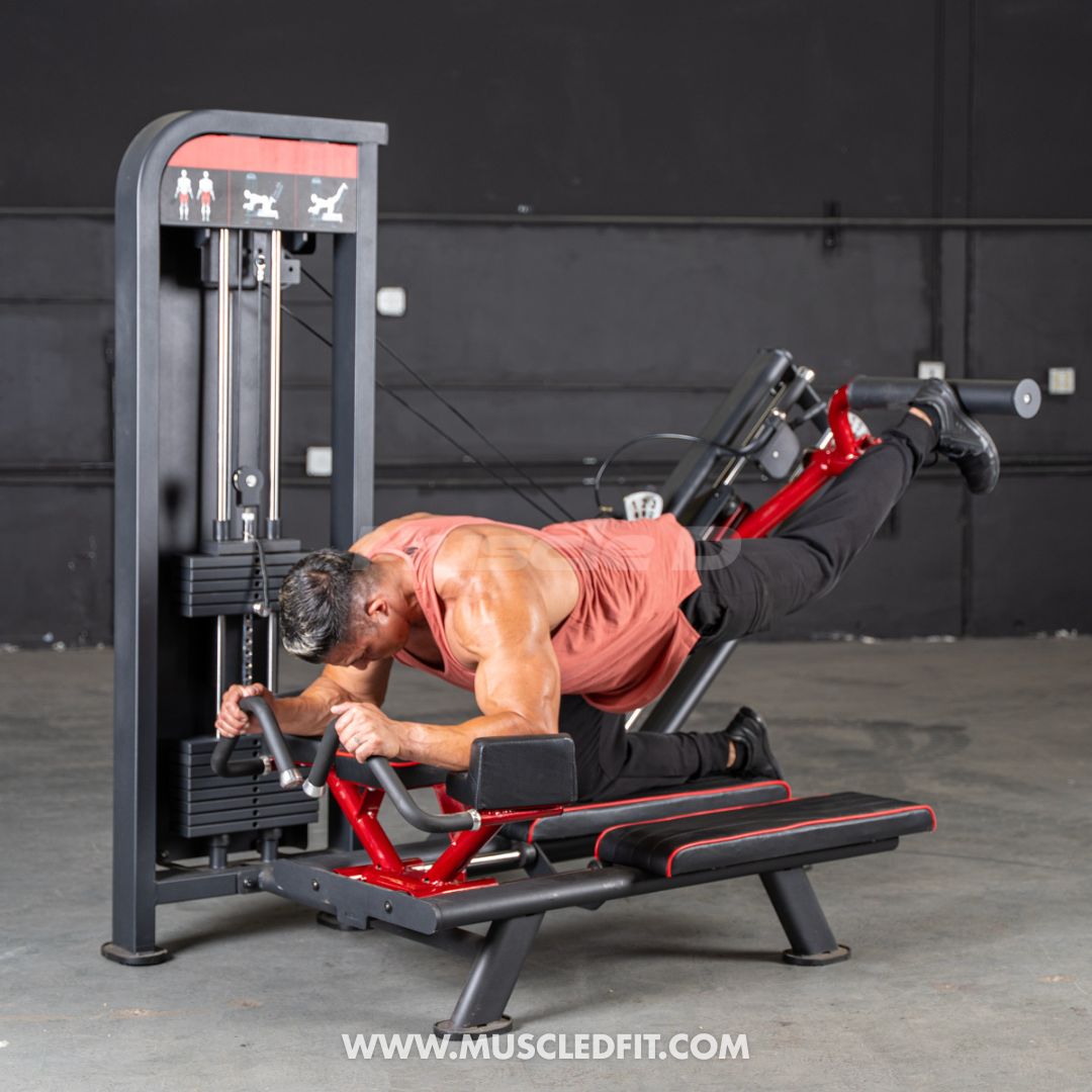 Man using a Classic V2 Glute Kick machine in a gym setting with 'MuscleDFit' branding.