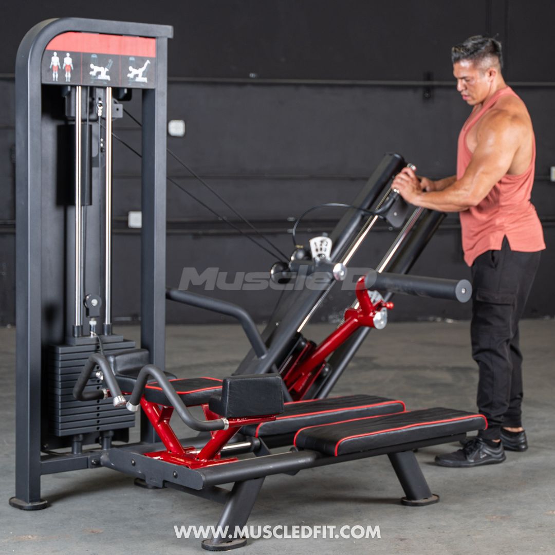 Man using a Classic V2 Glute Kick machine with 'Muscle D' branding in the background
